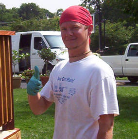 See Dirt Run Employee pressure washing jobs sealing log homes